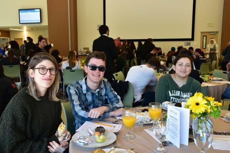 Students enjoying the grad breakfast